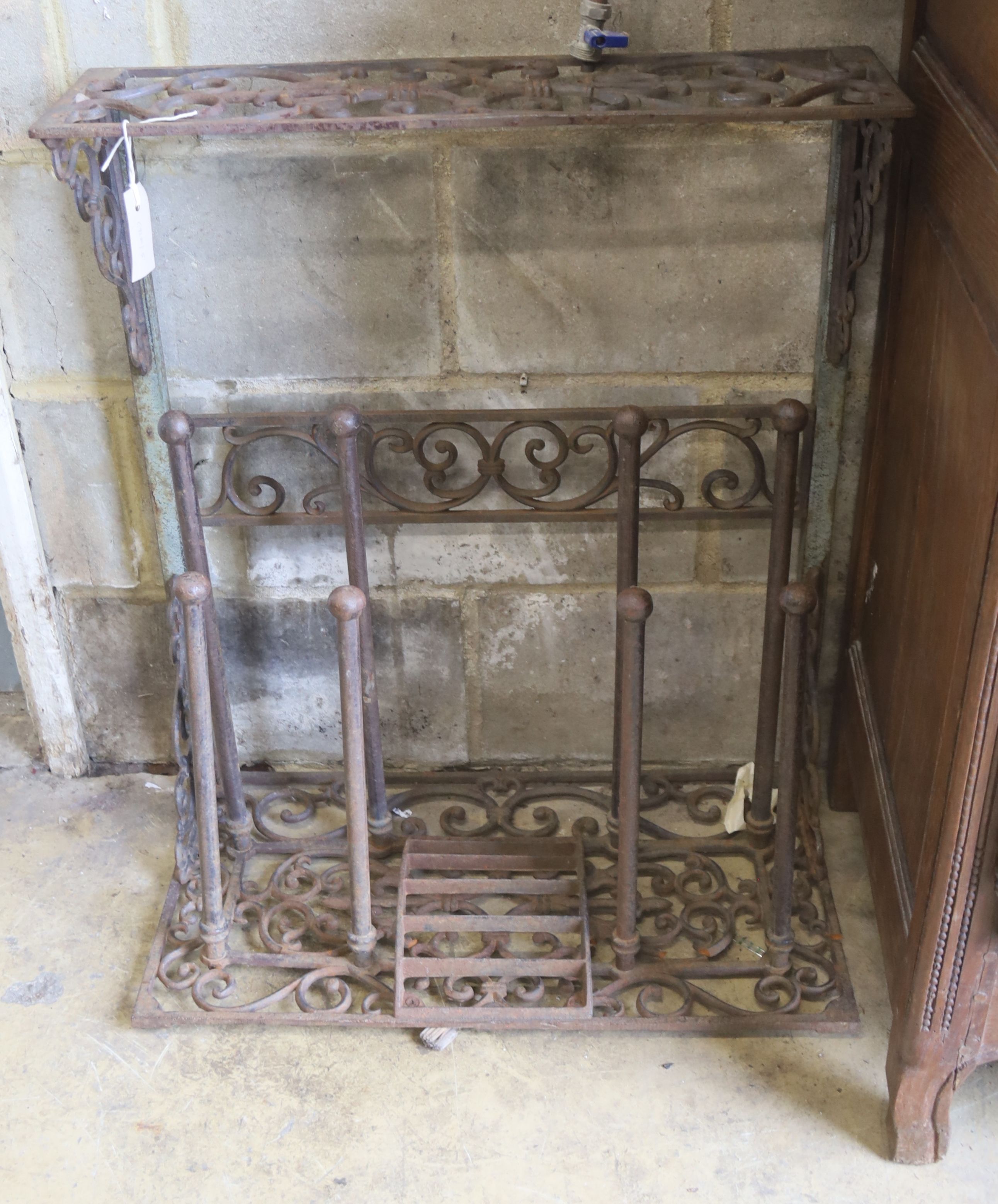A Victorian style cast metal boot rack combined scraper, width 64cm, depth 35cm, height 76cm
